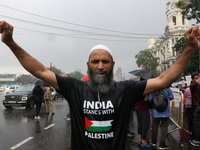 Indian supporters for Palestine are holding posters and the Palestine National Flag during a protest rally, amid the ongoing conflict in Gaz...