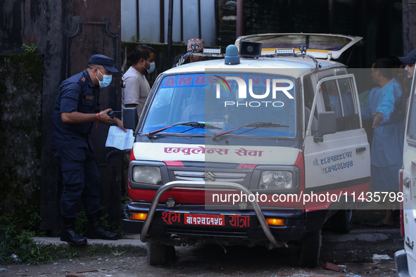 Dead body management staff at the morgue of Tribhuvan University Teaching Hospital are loading a body of the victim of the Saurya Airlines c...