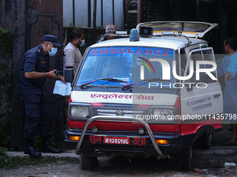 Dead body management staff at the morgue of Tribhuvan University Teaching Hospital are loading a body of the victim of the Saurya Airlines c...