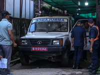 Dead body management staff at the morgue of Tribhuvan University Teaching Hospital are loading a body of the victim of the Saurya Airlines c...