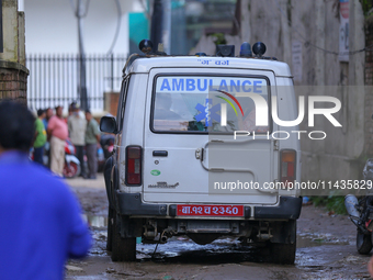 A hearse is carrying the body of a deceased in the Saurya Airlines crash, escorting it to the crematorium after being handed over to the fam...