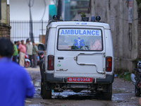 A hearse is carrying the body of a deceased in the Saurya Airlines crash, escorting it to the crematorium after being handed over to the fam...