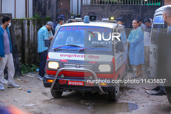 A hearse is carrying the body of a deceased in the Saurya Airlines crash, escorting it to the crematorium after being handed over to the fam...