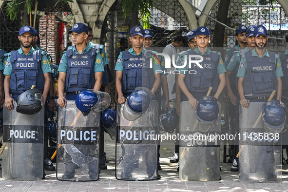 Bangladeshi Police are standing guard at the Baitul Mukarram National Mosque of Bangladesh, amid the anti-quota protests in Dhaka, Banglades...