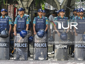 Bangladeshi Police are standing guard at the Baitul Mukarram National Mosque of Bangladesh, amid the anti-quota protests in Dhaka, Banglades...