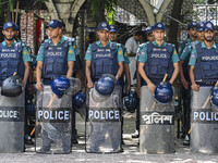 Bangladeshi Police are standing guard at the Baitul Mukarram National Mosque of Bangladesh, amid the anti-quota protests in Dhaka, Banglades...