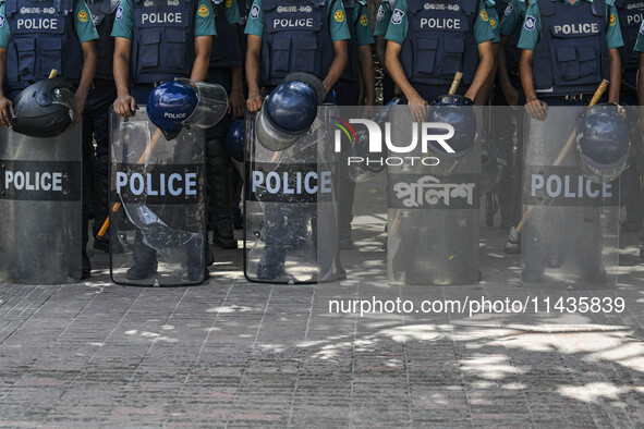 Bangladeshi Police are standing guard at the Baitul Mukarram National Mosque of Bangladesh, amid the anti-quota protests in Dhaka, Banglades...