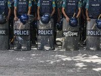 Bangladeshi Police are standing guard at the Baitul Mukarram National Mosque of Bangladesh, amid the anti-quota protests in Dhaka, Banglades...