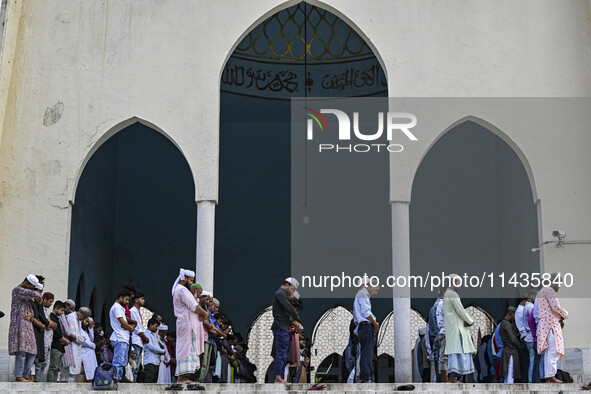 Bangladeshi Muslims are praying at a mosque for the deceased who died in indiscriminate killings and those injured during the anti-quota pro...