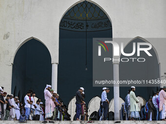 Bangladeshi Muslims are praying at a mosque for the deceased who died in indiscriminate killings and those injured during the anti-quota pro...