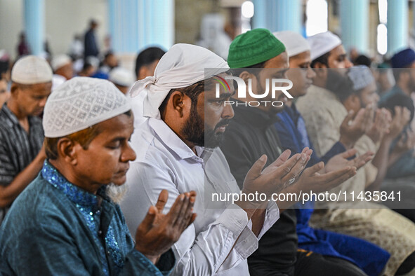 Bangladeshi Muslims are praying at a mosque for the deceased who died in indiscriminate killings and those injured during the anti-quota pro...