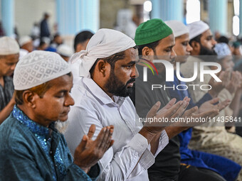 Bangladeshi Muslims are praying at a mosque for the deceased who died in indiscriminate killings and those injured during the anti-quota pro...