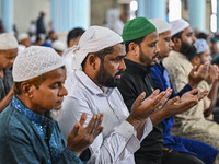 Bangladeshi Muslims are praying at a mosque for the deceased who died in indiscriminate killings and those injured during the anti-quota pro...