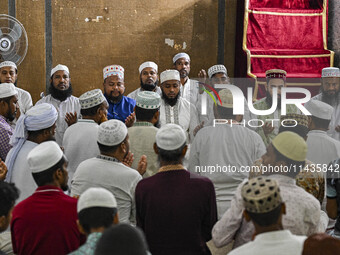 Bangladeshi Muslims are praying at a mosque for the deceased who died in indiscriminate killings and those injured during the anti-quota pro...