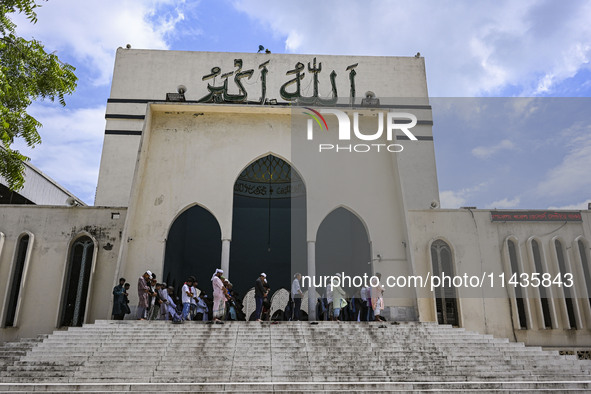 Bangladeshi Muslims are praying at a mosque for the deceased who died in indiscriminate killings and those injured during the anti-quota pro...