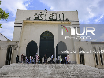 Bangladeshi Muslims are praying at a mosque for the deceased who died in indiscriminate killings and those injured during the anti-quota pro...