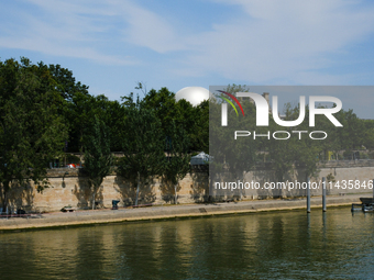 A hot air balloon is appearing in the Tuileries Garden, perhaps as the future cauldron for the Paris Olympic Games. (