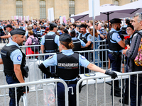 The gendarmerie is waiting in front of the queues of spectators at the Paris Olympic Games ceremony. (