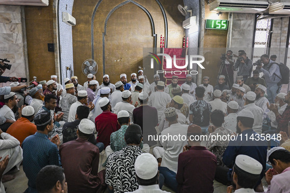 Bangladeshi Muslims are praying at a mosque for the deceased who died in indiscriminate killings and those injured during the anti-quota pro...