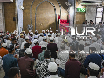 Bangladeshi Muslims are praying at a mosque for the deceased who died in indiscriminate killings and those injured during the anti-quota pro...