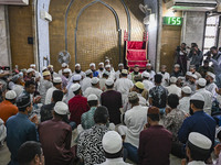 Bangladeshi Muslims are praying at a mosque for the deceased who died in indiscriminate killings and those injured during the anti-quota pro...