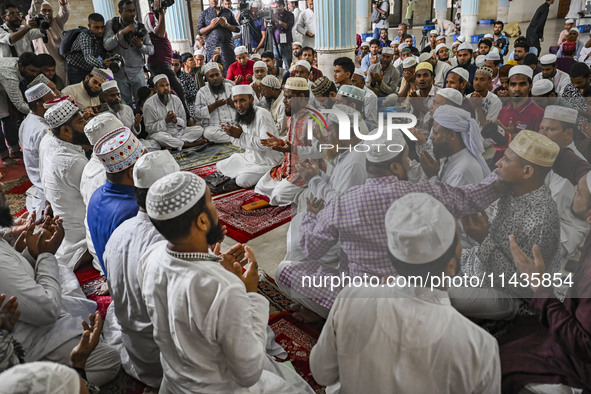 Bangladeshi Muslims are praying at a mosque for the deceased who died in indiscriminate killings and those injured during the anti-quota pro...