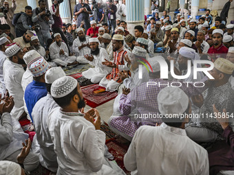 Bangladeshi Muslims are praying at a mosque for the deceased who died in indiscriminate killings and those injured during the anti-quota pro...