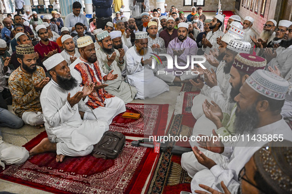 Bangladeshi Muslims are praying at a mosque for the deceased who died in indiscriminate killings and those injured during the anti-quota pro...