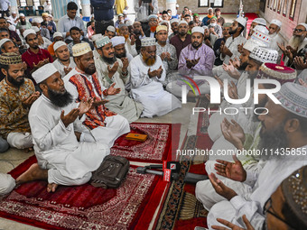 Bangladeshi Muslims are praying at a mosque for the deceased who died in indiscriminate killings and those injured during the anti-quota pro...