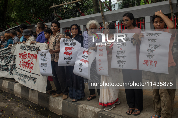 People are taking part in a song march to protest against the indiscriminate killings and mass arrests in Dhaka, Bangladesh, on July 26, 202...