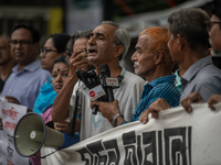 People are taking part in a song march to protest against the indiscriminate killings and mass arrests in Dhaka, Bangladesh, on July 26, 202...