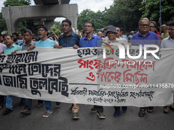 People are taking part in a song march to protest against the indiscriminate killings and mass arrests in Dhaka, Bangladesh, on July 26, 202...