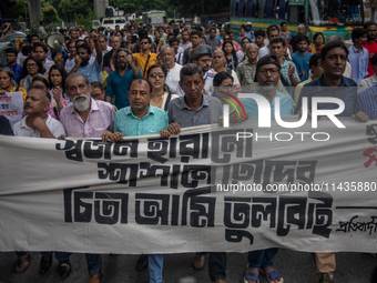 People are taking part in a song march to protest against the indiscriminate killings and mass arrests in Dhaka, Bangladesh, on July 26, 202...