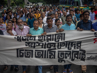 People are taking part in a song march to protest against the indiscriminate killings and mass arrests in Dhaka, Bangladesh, on July 26, 202...