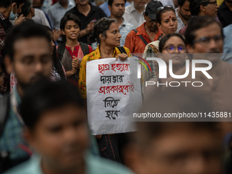 People are taking part in a song march to protest against the indiscriminate killings and mass arrests in Dhaka, Bangladesh, on July 26, 202...