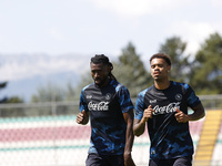 Frank Zambo Anguissa of Napoli and Cyril Ngonge of Napoli are participating in day 2 of the preseason training camp of SSC Napoli at Stadio...