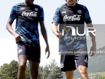 Victor Osimhen of Napoli and Mario Rui of Napoli are participating in day 2 of the preseason training camp of SSC Napoli at Stadio Patini in...