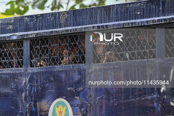 A police van is transporting protesters to the jail after their court hearing in Dhaka, Bangladesh, on July 26, 2024. The number of arrests...