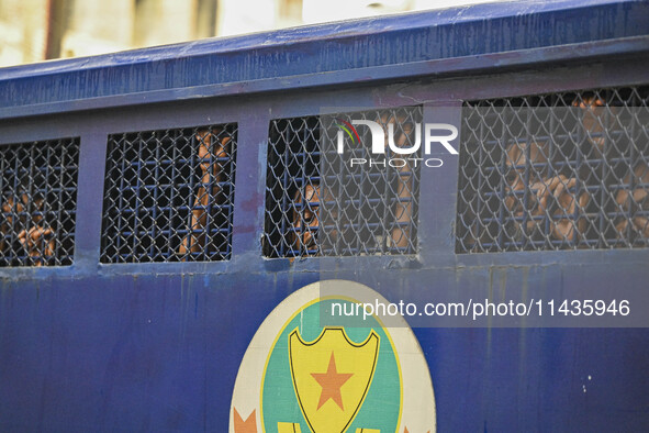 A police van is transporting protesters to the jail after their court hearing in Dhaka, Bangladesh, on July 26, 2024. The number of arrests...