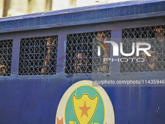 A police van is transporting protesters to the jail after their court hearing in Dhaka, Bangladesh, on July 26, 2024. The number of arrests...