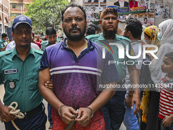 Police are taking protesters to the court after arresting them in Dhaka, Bangladesh, on July 26, 2024. The number of arrests in days of viol...