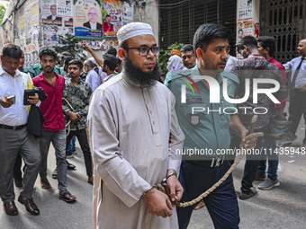 Police are taking protesters to the court after arresting them in Dhaka, Bangladesh, on July 26, 2024. The number of arrests in days of viol...