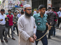 Police are taking protesters to the court after arresting them in Dhaka, Bangladesh, on July 26, 2024. The number of arrests in days of viol...