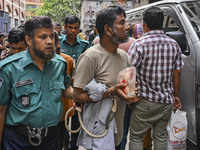 Police are taking protesters to the court after arresting them in Dhaka, Bangladesh, on July 26, 2024. The number of arrests in days of viol...