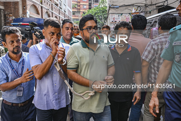 Police are taking protesters to the court after arresting them in Dhaka, Bangladesh, on July 26, 2024. The number of arrests in days of viol...