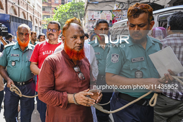 Police are taking protesters to the court after arresting them in Dhaka, Bangladesh, on July 26, 2024. The number of arrests in days of viol...