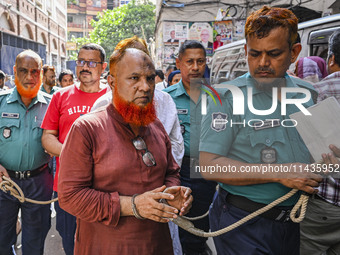 Police are taking protesters to the court after arresting them in Dhaka, Bangladesh, on July 26, 2024. The number of arrests in days of viol...