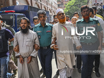 Police are taking protesters to the court after arresting them in Dhaka, Bangladesh, on July 26, 2024. The number of arrests in days of viol...