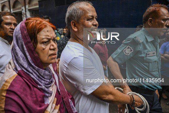 Police are taking protesters to the court after arresting them in Dhaka, Bangladesh, on July 26, 2024. The number of arrests in days of viol...