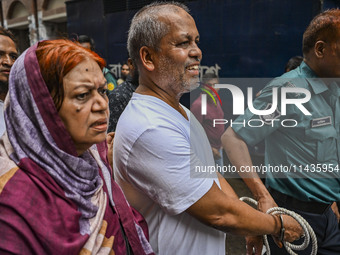 Police are taking protesters to the court after arresting them in Dhaka, Bangladesh, on July 26, 2024. The number of arrests in days of viol...